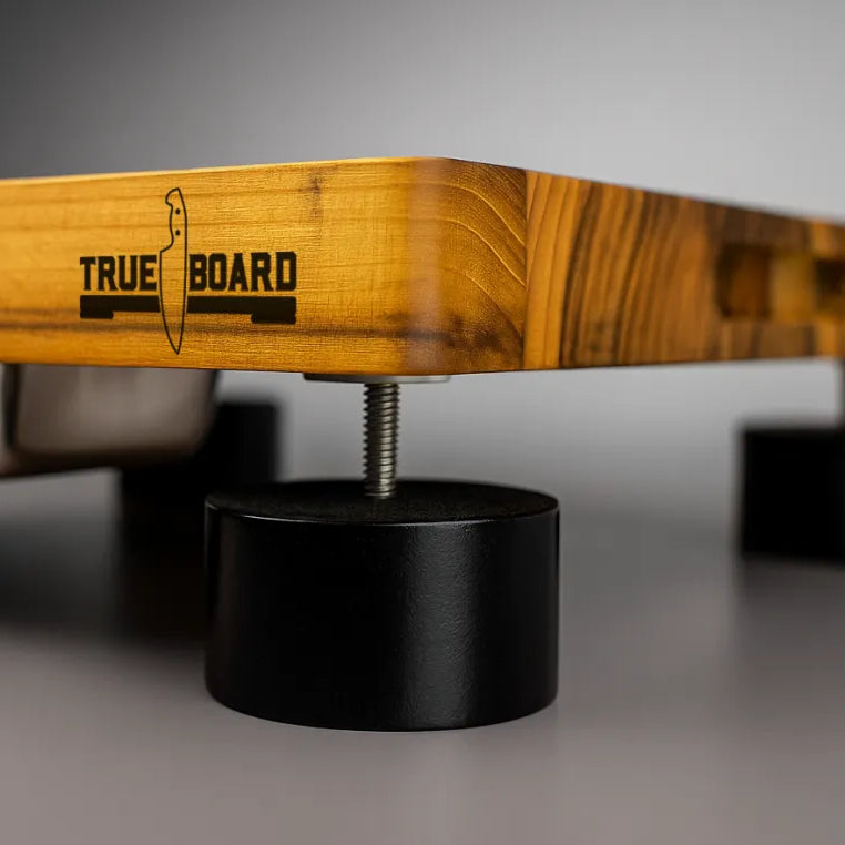 Adjustable foot under The True Board setting the slope