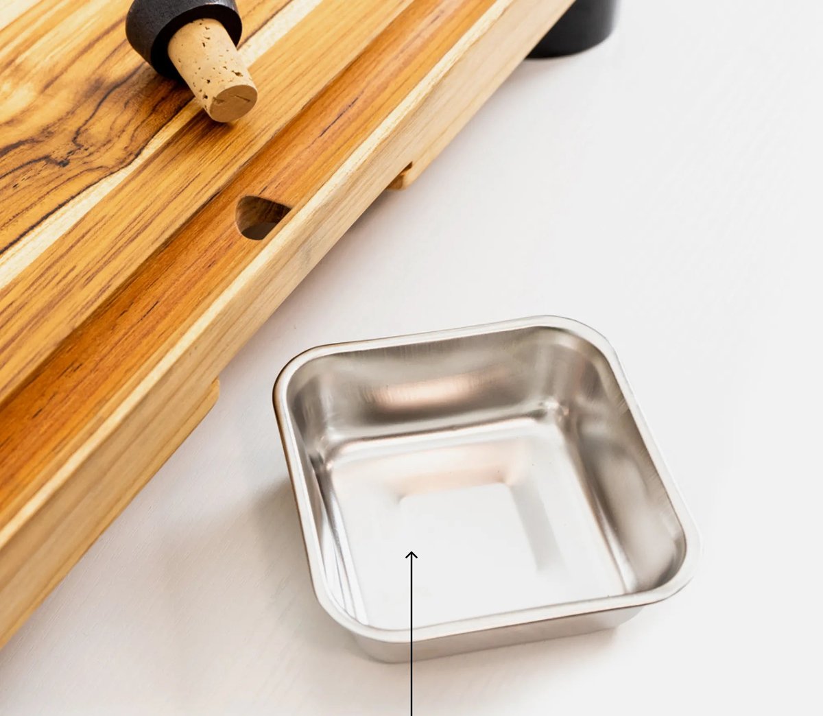 Removable stainless steel bowl under the drop hole of The True Board