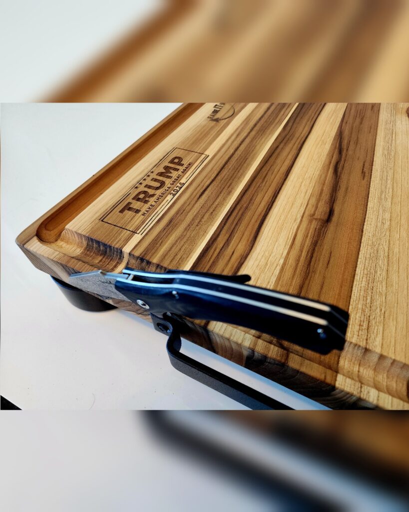 Carving roast on teak cutting board with juice groove